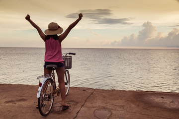 Girl both hand background sunset at the sea