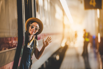 Girl traveling the tourist train station, Active and travel lifestyle concept
