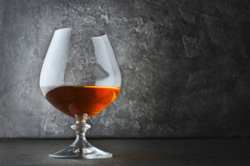 Strong alcoholic drink cognac in sniffer glass for tasting
