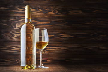 White wine bottle and glass for tasting with copy space