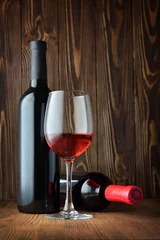 Fotobehang Red wine bottle and glass for tasting in cellar © viktoriya89