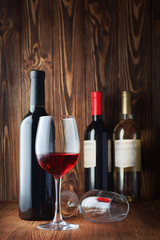 Fototapeta na wymiar Red and white wine bottles and glasses for tasting