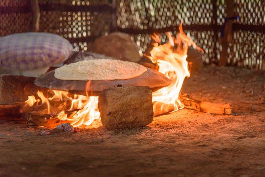 Preparing traditional bread on street market in Lorestan Province. Iran