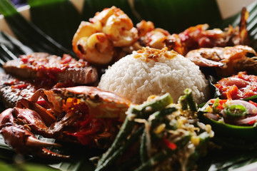 Typical dish of Thai cuisine, consisting of white rice, fish and meat. Presentation of gourmet Asian dish. Concept of: food, culture and tradition.