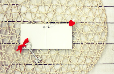 valentines day background, blank paper tag, key with red bow and heart