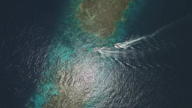 Aerial view of the motorboats pass over coral reef gangway - Shaab Rumi, Red Sea
