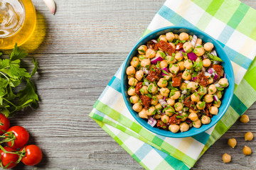 Chickpeas salad with onion and dried tomatoes.