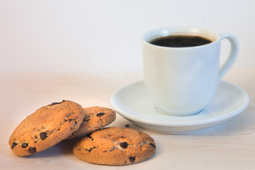 Cup of coffee with oatmeal cookies