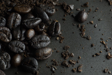 The  coffee roasted on  black texture close up background..