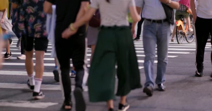 People crossing the road at night