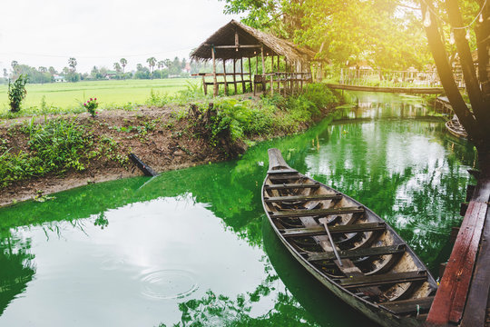 cottage and boat at famous canal at countryside in thailand