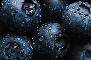 Top view macro shot of fresh blueberry with water drops