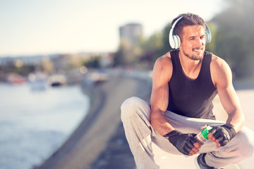 fitness man taking a break after jogging