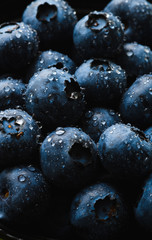 Top view macro shot of fresh blueberry with water drops