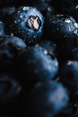 Top view macro shot of fresh blueberry with water drops