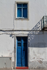 Old house in Azores island with blue window and door 