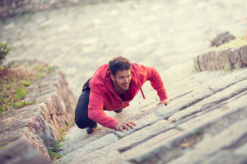 Climber climbing up the wall