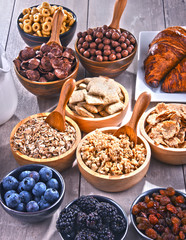 Different sorts of breakfast cereal products and fresh fruits
