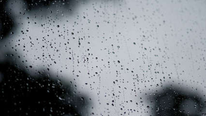 Raindrops texture on the glass window frame