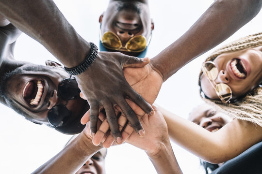 Group of friends stacking hands