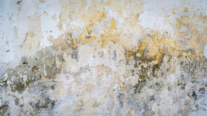 old plastered wall with spots from water