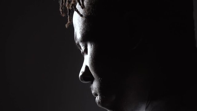 In the darkness there is a black man