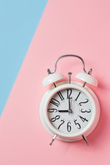 Alarm on color block background. Pastel minimalism