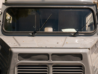 front end of a gray antique pickup truck