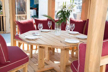 Typical summer outdoor terrace Tables and chairs ready to eat