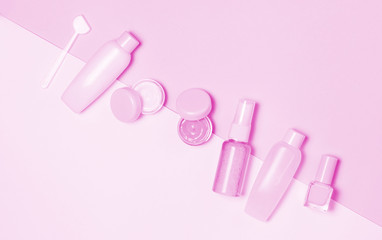 Pink decorative cosmetic on pink background.
