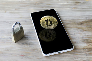 Bitcoin Cryptocurrency Digital Bit Coin BTC Currency Technology Business Internet Concept. Bitcoin over smartphone