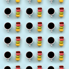 A pattern of many colorful dessert cake macaroon and coffee cups on trendy pastel blue background top view. Flat lay composition