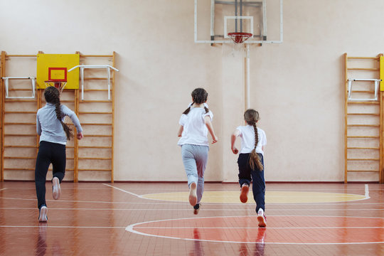 Primary School Children A Sport Lesson Indoors