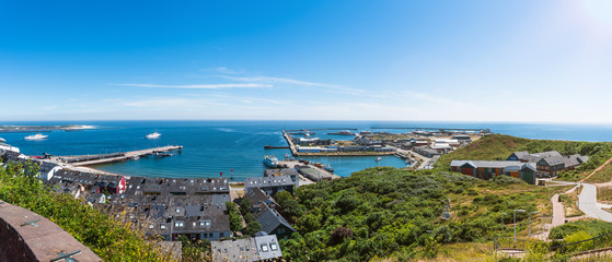 high angle panoramic view of Helgoland Island against blue sea and clear sky