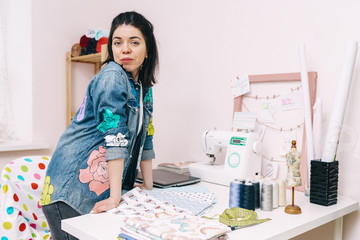 Young Fashion designer working in studio