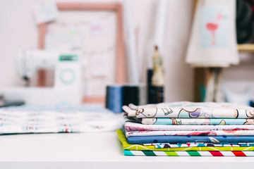 Tailor workplace. Designer studio. Table with fabric samples