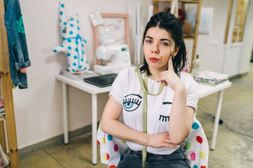Portrait of Young Fashion designer working in studio