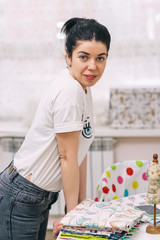 Young Fashion designer working in studio