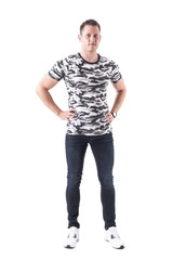 Naklejka premium Relaxed happy caucasian adult man standing with hands on hips and smiling at camera. Full body isolated on white background. 