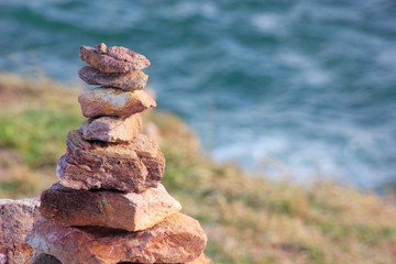 Fototapeta premium Stone sort at the sea or beach.Successful concept ,have a good support, zen stone.
