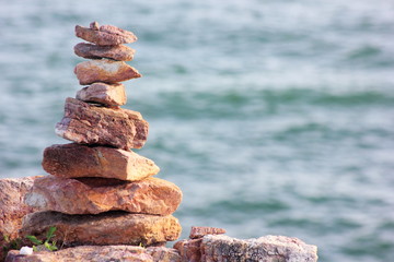 Stone sort at the sea or beach.Successful concept ,have a good support, zen stone.