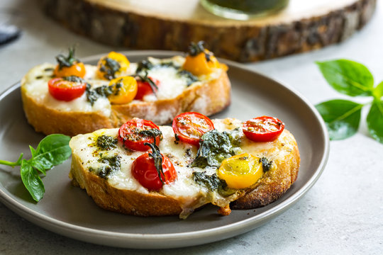  Mozzarella with Cherry Tomatoes and Basil Pesto on toasts