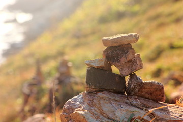 Stone sort at the mountain with blue sky.Successful concept ,have a good support, zen stone.