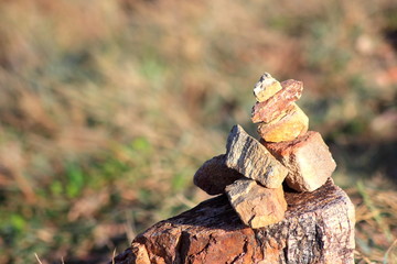 Stone sort at the mountain with blue sky.Successful concept ,have a good support, zen stone.
