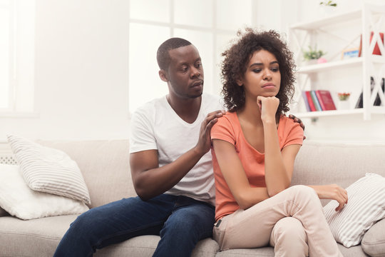 Young black couple quarreling at home
