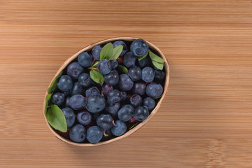 The forest berries. Blueberries on a natural background.