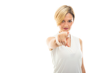 Portrait of young pretty business woman pointing camera.