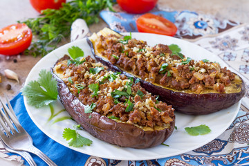 Baked eggplants with meat, walnut and vegetables. Traditional middle eastern or arab dish.