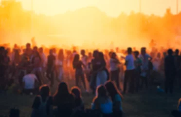 Foto auf Acrylglas Crowd at summer music festival, blurred people during concert © leszekglasner