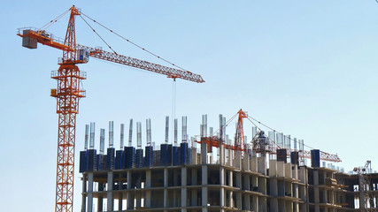 Construction crane near building. Construction site.